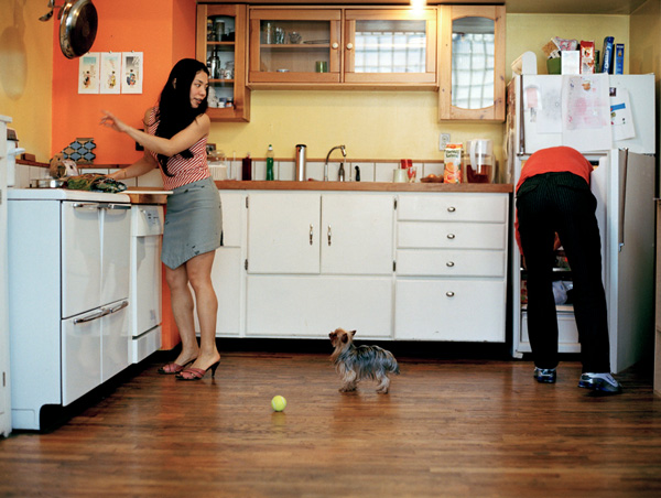 Young couple with dog in kitchen, Brooklyn New York by Sherrie Nickol